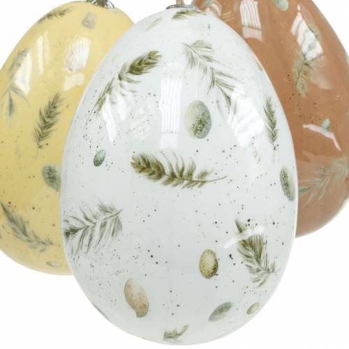 Floristik24 Oeufs de Pâques à suspendre avec motif oeufs et plumes blanc, marron, jaune assortis 3pcs