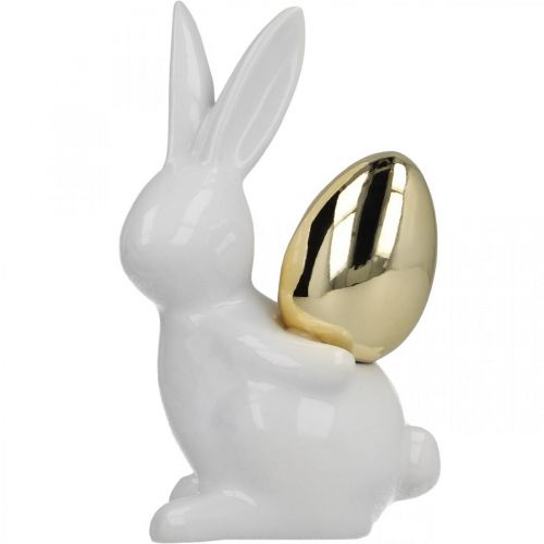 Article Lapins avec oeuf d&#39;or, lapins en céramique pour Pâques blanc noble, doré H13cm 2pcs